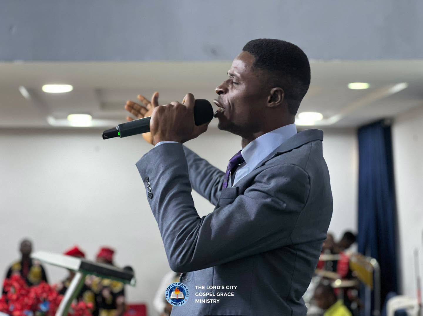 A minister speaking into a microphone