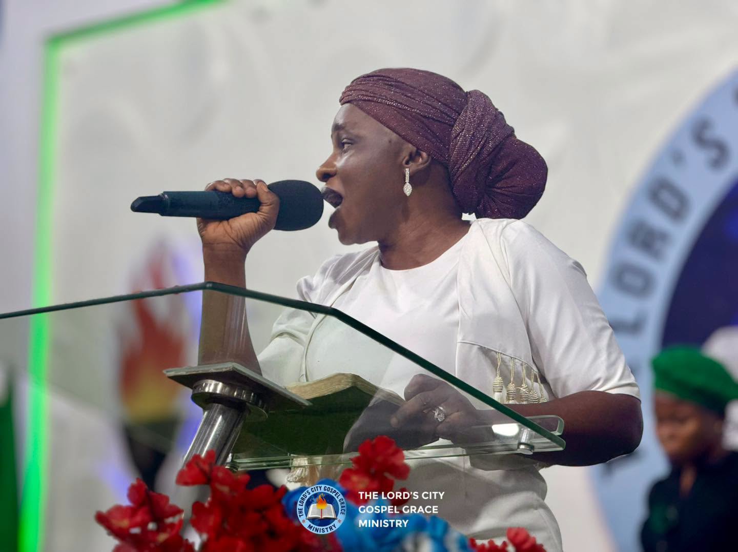 A worship leader singing at the church